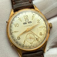 Reloj corona triple calendario revisado